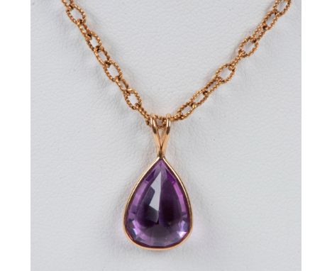 14K gold chain with a pear-cut lab. amethyst pendant that measures 1"L x 0.5"W. Dimensions: 15.25"LCondition: Age related wea