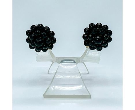 This vintage pair of earrings features black sphere floret design with screw back fastening. Issued: c. 1950Dimensions: 1"L x