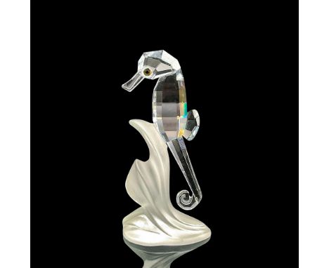 Clear faceted crystal figure of a seahorse with green eyes resting on a frosted plant base. Part of the Aquatic Worlds collec