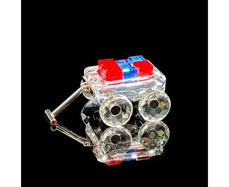 This Crystal Memories toy wagon has rhodium metal detail. Part of the My first years series, the toy wagon holds red and blue