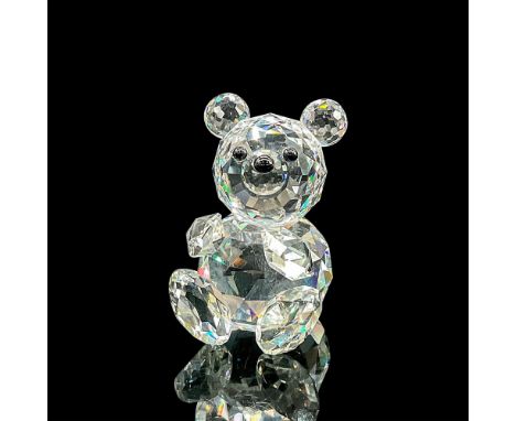 Sparkling cut crystal figure of a seated bear with black eyes and nose, arms out, ready to hug. Item number 7637NR054000. Swa