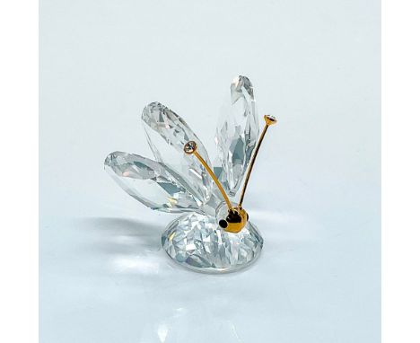 Multifaceted clear crystal with black eyes, gold tone antennae with crystal tips. Swarovski etched backstamp. Certificate of 