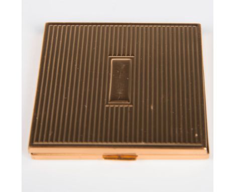Charming and smart gold tone compact. The outside of the case is ribbed with a simple center design. Mirror inside and second