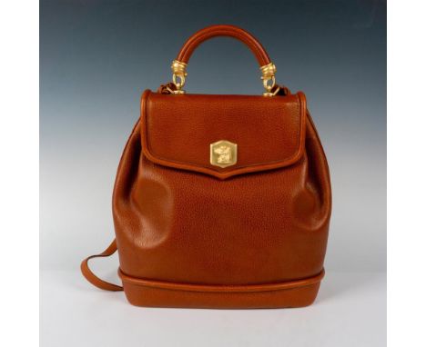 Vintage yellow-camel leather first edition 1991 year bag. One large center pocket divides the purse's interior with a second 