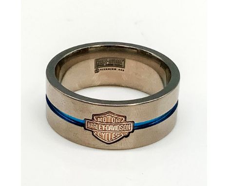 Satin titanium band with a gold washed sterling silver Harley Davidson logo and thin blue channel stripe around the middle. T