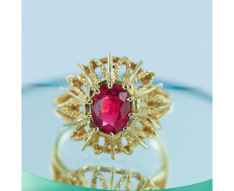 Natural Ruby center stone set in domed yellow gold. Stamped 14K and LeVian inside the band. Size 7. Condition: Age related we