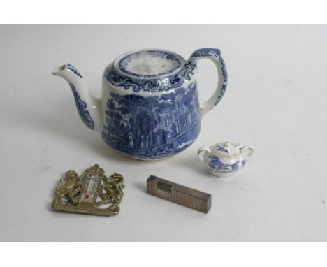 A Victorian blue and white teapot, blue and white miniature coalport sugar pot and a Colibri lighter and brass ER plaque ther