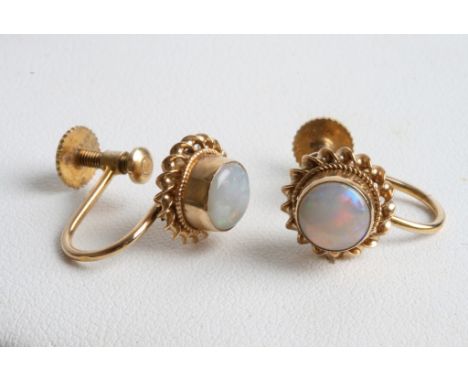 A pair of ladies 9ct gold earrings set with opal cabochons