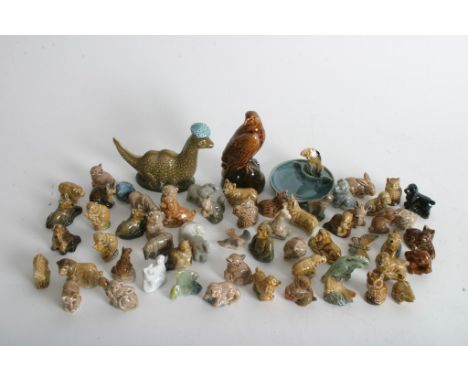 A collection of Wade Whimsies plus two small Beswick Scotch Whisky models of an eagle and The Loch Ness Monster