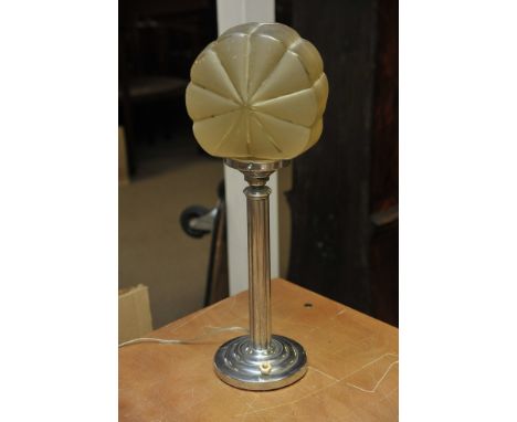 An Art Deco chrome side lamp with yellow stylized shade. 
