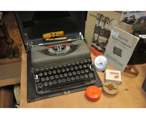 An Imperial 'Good Companion' Model T Portable Typewriter in carry case including instruction book, sales leaflet, unused type