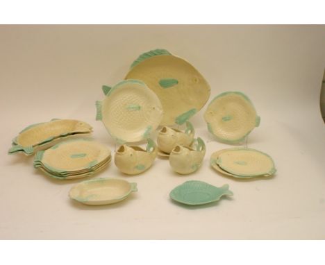 A shorter's ceramic fish shaped dinner service including sauce boats and plates of various sizes