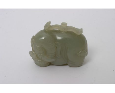 A Chinese green hardstone carving in the form of a stylised elephant, possibly jade. Length: 4.5cm approximately