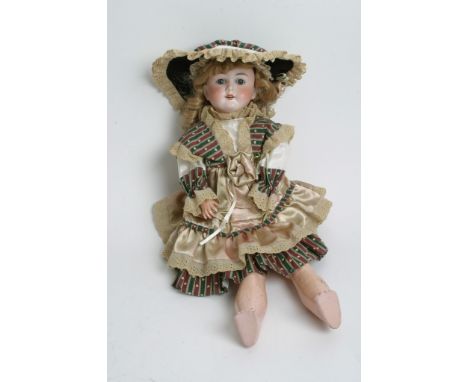 A German bisque headed doll by Max Handwerck having closing eyes and open mouth