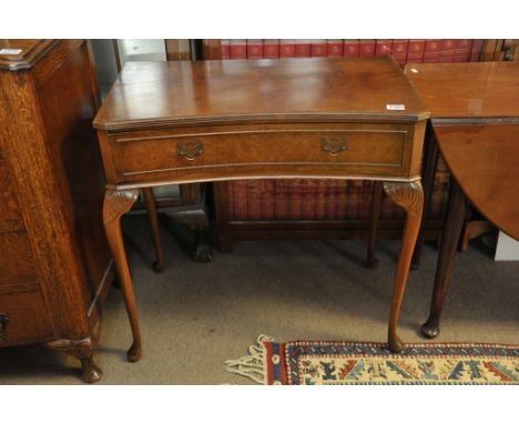 A reproduction Queen Anne style quarter veneer console table