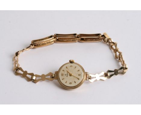 A ladies gold watch with later applied opal set mount