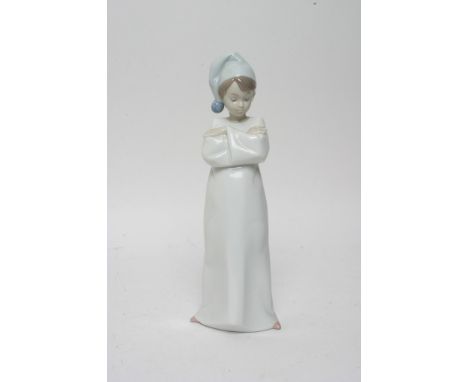A Lladro model of a young boy