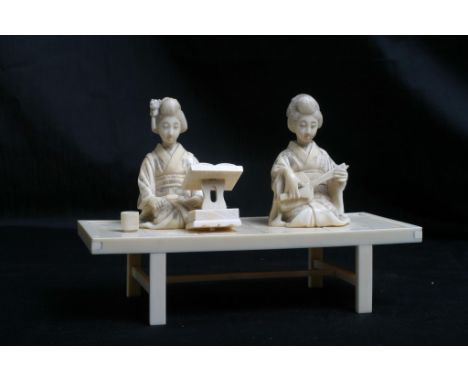 A Japanese constructed Ivory Okimono female figure group playing a musical instrument on a simulated wood stage Measures 12 c