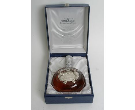 A limited edition bottle of De Luxe twelve years old Whyte & Mackay blended Scotch Whisky in presentation box celebrating the