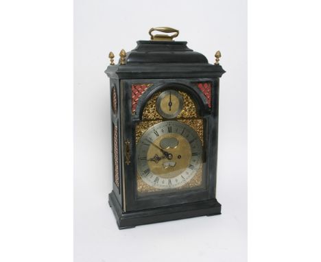A Georgian bracket clock having cherub decoration and name 'Geo Clerke, London' to dial, with pendulum