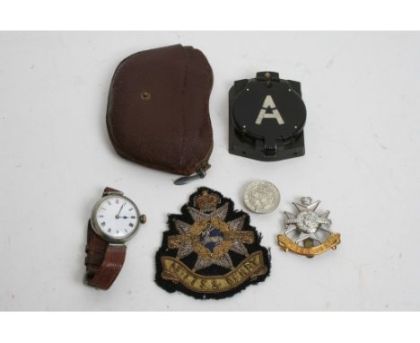 A military compass, a gent's wrist watch and cap badge. 