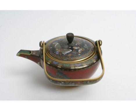 A exceptionally fine quality Japanese gilt bronze and cloisonne teapot finely enamelled with detailed butterflies, flowers an