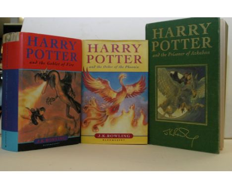 A box containing Harry Potter books including First Editions, other books including the Festival of Prayer, German and Polish