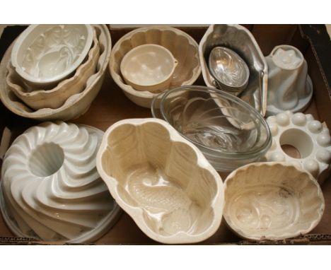 A box of various old ceramic jelly moulds