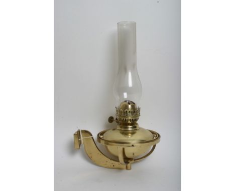 A brass gimble oil lamp