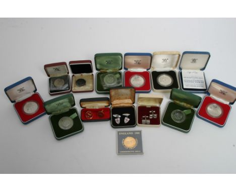 A collection of cased proof coins, mainly silver, and some cased cufflinks