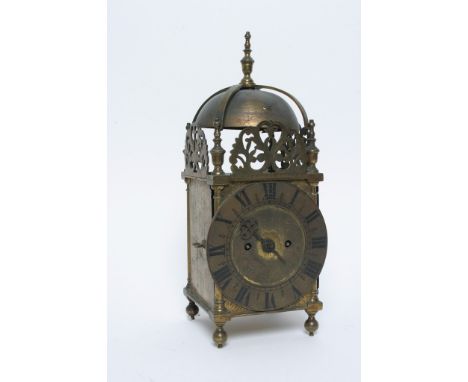 A brass lantern clock with key and pendulum