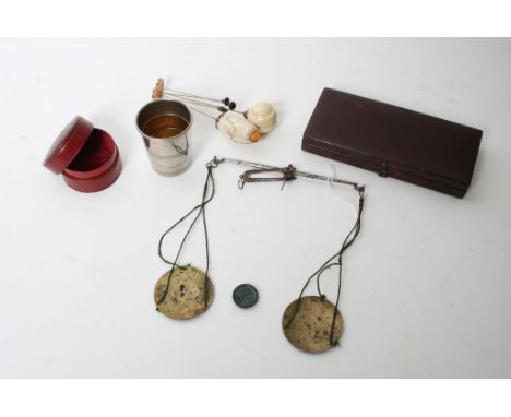 A cased folding stirrup cup, a case of small brass scales, and five hat pins. 