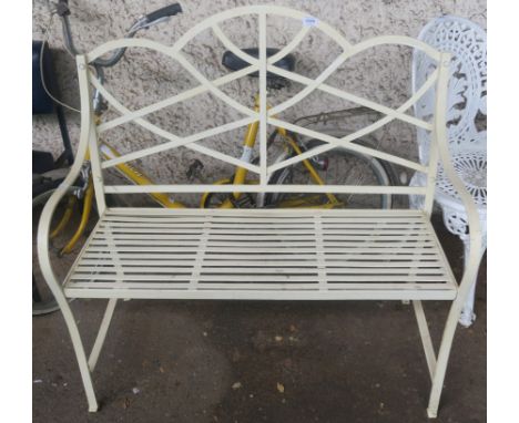 A modern wrought iron garden two seater bench, 98cm high x 101cm wide x 50cm deep Condition Report: Available upon request