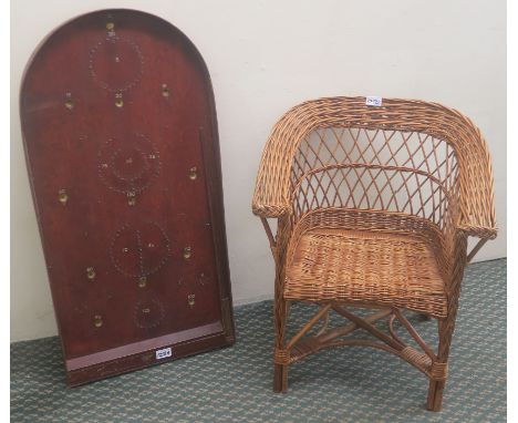 A Lumley Ltd bagatelle board and a child's wicker chair (2) Condition Report: Available upon request