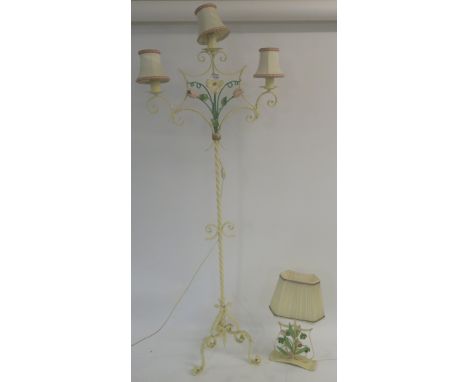 A vintage wrought iron standard lamp with tulip and a daffodil decoration with a similar table lamp (20 Condition Report: Ava