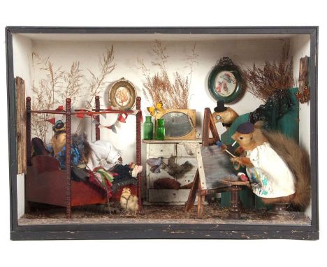 Late 19th/early 20th Century cased anthropomorphic taxidermy scene of two Squirrels and a stoat in bedroom /boudoir setting t