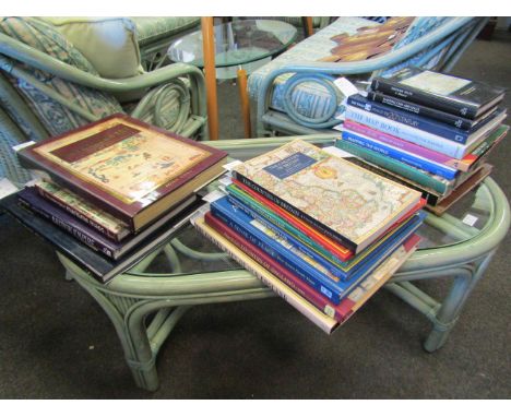 A large quantity of books on maps including "Mapping time and space" and "The men who mapped the world"