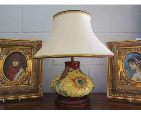 A Moorcroft table lamp with 'Sunflower' design on base and dated 13.5.95 complete with shade