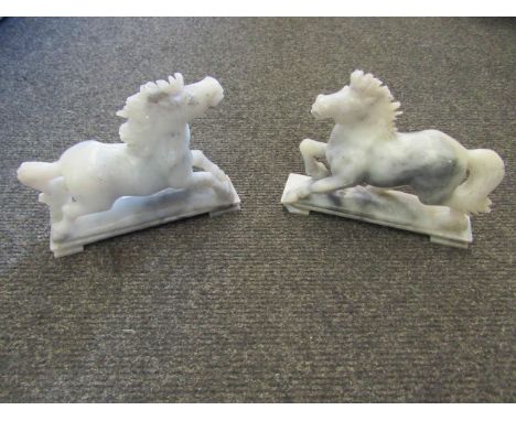 A pair of grey jade horses on stands, 14.5cm long