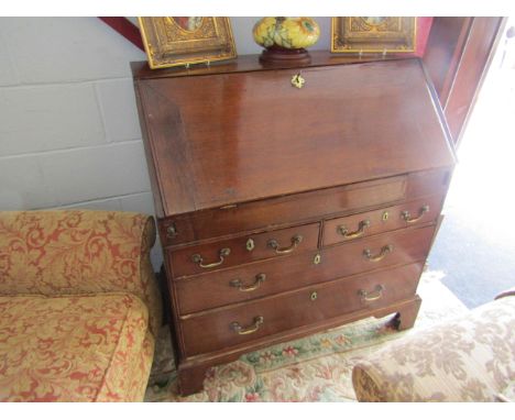 A 19th Century oak drop flap bureau with fitted interior and a two over two chest on bracket feet, 99cm x 95cm x 50cm