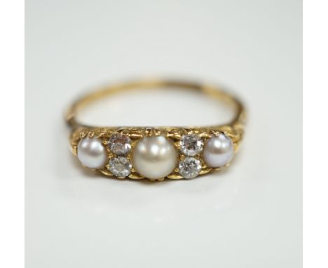 An early 20th century 18ct and plat, three stone split pearl and four stone diamond set half hoop ring, size P, gross weight 