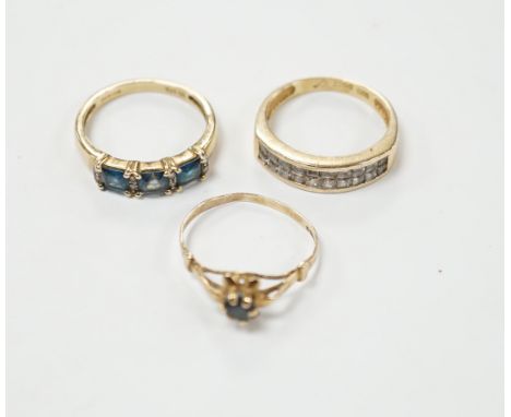 Two 9ct gold dress rings, one set with sapphire and diamonds, the other a single sapphire, and a diamond chip set ring, stamp