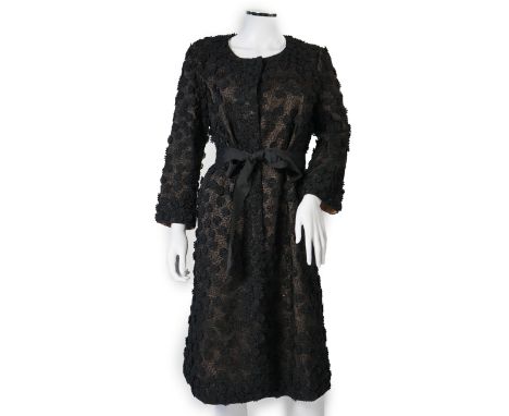 A Nicole Farhi lady's black lace knee length jacket with flower embellishment all over with black ribbon tie belt, size 12***