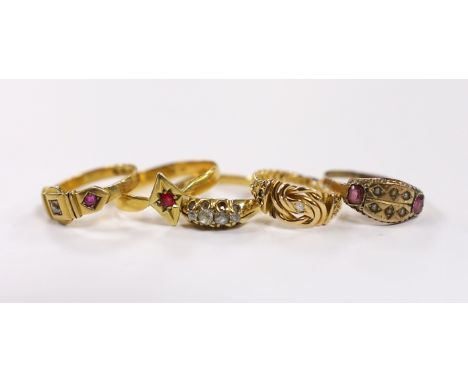 A Victorian 22ct gold and single stone ruby set ring, size S, gross 3.2 grams, a Victorian 18ct gold, ruby and diamond set th