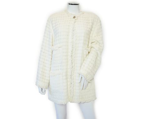 A Chanel early 1990's cream boutique jacket, with fringing to all edges, single CC silver-tone button, two pockets each side,
