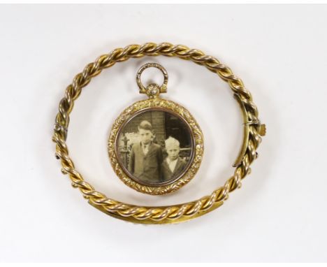 An Edwardian 9ct and graduated seed pearl set hinged bangle (pearl missing), gross weight 12.7 grams and a yellow metal overl