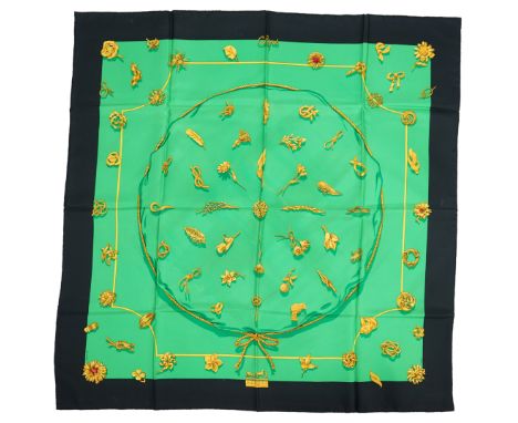 A Hermès 'Clips' 1986 Vladimir Rybaltchenko silk scarf, in vibrant green and gold with navy blue border, with original box, 9