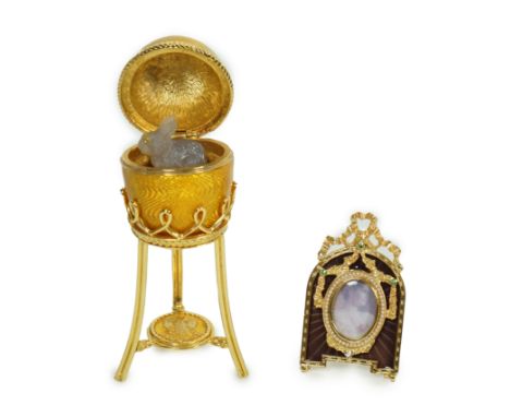 A Fabergé Imperial Collection Menagerie Rabbit Surprise Egg on stand together with a Fabergé gilt and enamel photograph frame