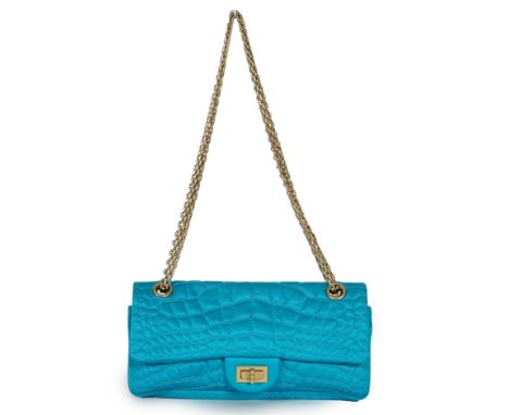 A Chanel medium-sized 2-55 bag in turquoise blue silk satin stitched with a quilted crocodile pattern, embellished with a mad