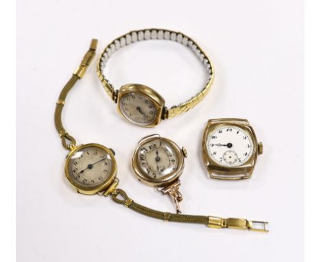 A lady's 18ct gold manual wind wrist watch on a twin fabric strap and three similar 9ct gold wrist watches.***CONDITION REPOR